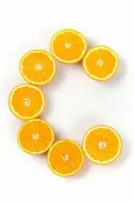 Orange halves arranged in the letter C
