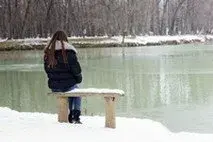 woman staring at the lake
